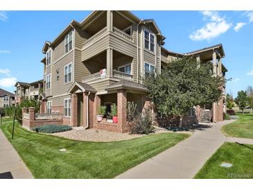 Attractive 3-story apartment building with brick and siding at 12926 Ironstone Way # 201, Parker, CO 80134