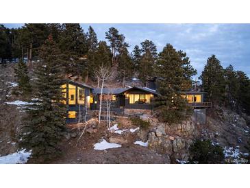 Mountaintop home with stunning views and unique architecture at 22598 Westview Ave, Golden, CO 80401