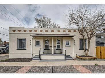 Charming duplex featuring unique brickwork and inviting front entrances at 715 W 7Th Ave, Denver, CO 80204