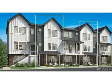 Modern townhome featuring a stylish facade, private patios, and inviting curb appeal in a well-maintained community at 700 Saddle Dr, Erie, CO 80516