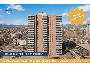 Multi-story condominium building with balcony views of the city skyline and mountain range under a bright blue sky at 130 N Pearl St # 1606, Denver, CO 80203