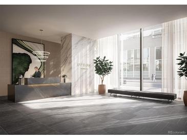 Bright lobby with modern design elements, including a marble reception desk and large windows at 525 18Th St # 1203, Denver, CO 80202