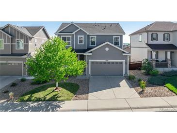 Charming two-story home with well-manicured lawn and a spacious two-car garage at 7686 Grady Cir, Castle Rock, CO 80108
