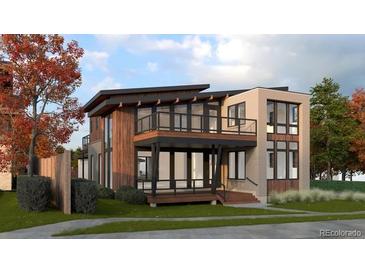 Stunning modern home with a two-story design, balconies, and a mix of wood and brick facade at 1016 24Th St, Golden, CO 80401
