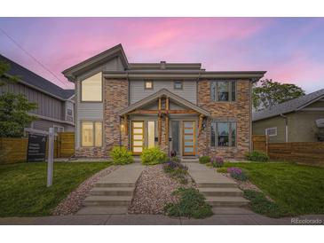 Modern townhomes boasting mixed brick and siding exteriors, complemented by professionally landscaped front yards and welcoming walkways at 2442 S Bannock St, Denver, CO 80223