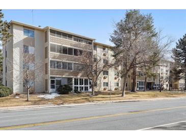 Front view of a two-story building with landscaping at 3184 S Heather Gardens Way # 403, Aurora, CO 80014