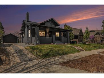 Charming single-Gathering home with a well-manicured lawn and an inviting covered front porch at 2659 Ash St, Denver, CO 80207