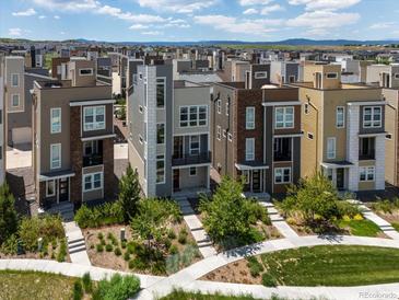 Stunning multi-story home featuring modern design and professional landscaping in a vibrant neighborhood setting at 3654 Penang Dr, Castle Rock, CO 80109
