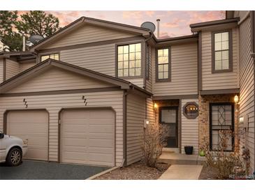 Charming townhome with a two-car garage and neutral siding under a colorful sunset at 871 S Joplin Cir, Aurora, CO 80017
