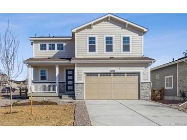 Charming two-story home featuring a two-car garage, neutral siding and a welcoming front porch at 24709 E 39Th Ave, Aurora, CO 80019