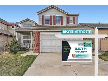 Charming two-story home with red shutters, attached garage, and manicured front lawn at 12362 Nate Cir, Parker, CO 80134