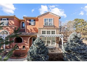 Two-story townhome with inviting front porch and landscaping at 13953 E Princeton Pl # B, Aurora, CO 80014