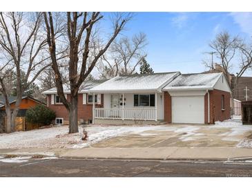 Charming brick home with a cozy front porch and attached one car garage at 31 W Fremont Ave, Littleton, CO 80120