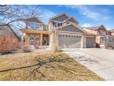 Charming two-story home with a three-car garage and a well-maintained lawn at 13457 Locust St, Thornton, CO 80602