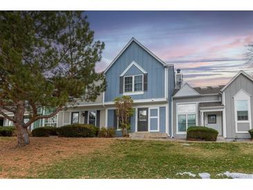 Charming home featuring blue siding, neat landscaping, and a well-maintained front yard at 19618 Rosewood Ct, Parker, CO 80138