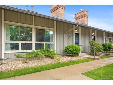 Charming townhouse showcasing mature landscaping, a well-kept walkway, and cozy, welcoming facade at 6495 E Happy Canyon Rd # 171, Denver, CO 80237