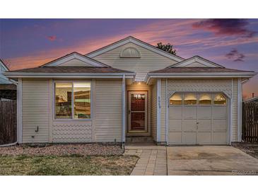 Charming home featuring neutral siding, an attached one-car garage, and a well-manicured front yard at 3090 S Telluride St, Aurora, CO 80013