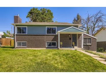 Charming two-story home with a combination of brick and siding, nestled on a well-maintained lawn at 9540 King Way, Westminster, CO 80031