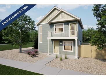 Charming two-story home featuring a quaint balcony and well-maintained landscaping at 46541 Avery Ln, Bennett, CO 80102