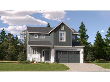 Two-story home featuring gray siding, white stone accents, a front porch, and a two-car garage at 10968 Snowdon St, Parker, CO 80134