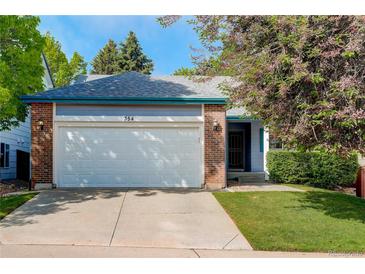 Charming single-story home featuring a brick and siding facade, attached garage, and well-maintained landscaping at 354 Willowick Cir, Highlands Ranch, CO 80129