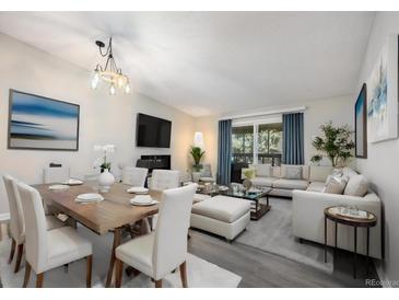 Open living and dining area featuring new light fixture, furniture, and neutral paint colors at 650 S Clinton St # 6D, Denver, CO 80247