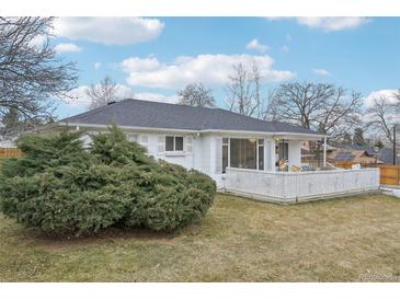 Charming backyard features a well-maintained lawn and patio, perfect for outdoor relaxation and entertaining at 3075 S Emerson Way, Englewood, CO 80113