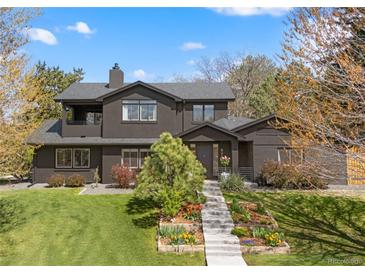 Stunning home with professionally landscaped yard and charming exterior elevation at 970 S Steele St, Denver, CO 80209