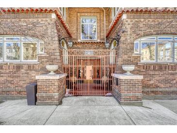 Attractive brick exterior featuring a gated entrance to the property with beautiful architecture and design at 861 N Humboldt St # A, Denver, CO 80218