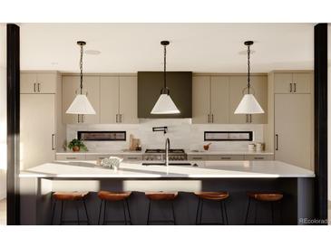 Bright kitchen features an island with a white countertop, seating, and pendant lighting at 5326 Lions Paw St, Castle Rock, CO 80104
