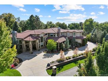 Stunning aerial view of estate with sprawling driveway and lush landscaping under a blue sky at 2 Viking Dr, Englewood, CO 80113