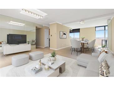 Bright living room features a mirrored wall, dining area and balcony access at 2880 S Locust St # 708S, Denver, CO 80222