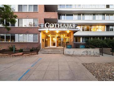 Attractive entrance to the Gotham Building with signage and landscaping at 1196 N Grant St # 501, Denver, CO 80203