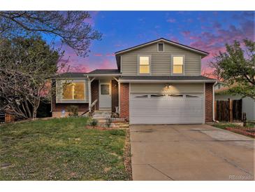 Charming two-story home with landscaped yard and a two car garage in a quiet neighborhood at 19707 E Princeton Pl, Aurora, CO 80013