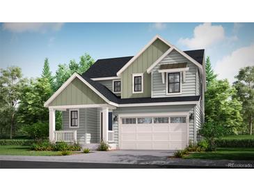 Charming two-story home with a covered porch, two-car garage, and inviting curb appeal at 39735 Gibson St, Elizabeth, CO 80107