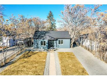 Updated bungalow with new paint, landscaping, and driveway at 1361 W Custer Pl, Denver, CO 80223