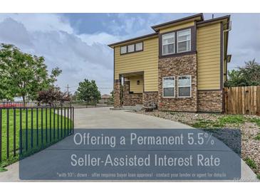 Modern two-story home with stone accents, manicured landscaping and inviting curb appeal at 4190 W Alameda Ave, Denver, CO 80219