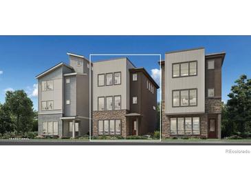 Modern three-story home featuring a mix of stone, horizontal, and vertical siding at 10898 E Hinsdale Cir, Centennial, CO 80112