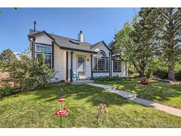 Charming two-story home with landscaped yard and inviting front entrance at 330 N Wagonwheel Trl, Castle Rock, CO 80104