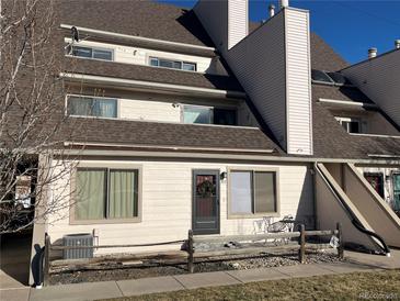 Charming townhouse featuring a cozy front porch and well-maintained landscaping, perfect for relaxed outdoor living at 4246 S Eldridge St # 103, Morrison, CO 80465