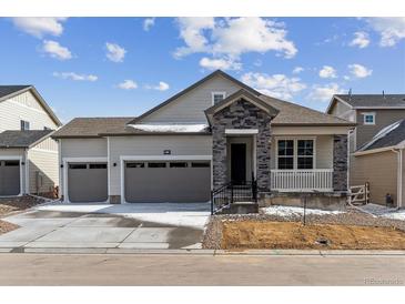 Charming single-Gathering home with stone accents, attached two-car garage, and a covered porch at 39172 Clymer St, Elizabeth, CO 80107