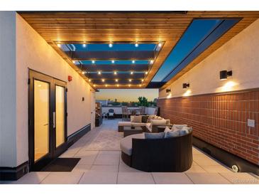 Inviting rooftop deck with stylish seating, ambient lighting, and scenic views for relaxation and entertainment at 485 E Arizona Ave, Denver, CO 80210