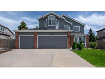 Charming two-story home with a spacious three-car garage and well-maintained landscaping at 1874 Cedaridge Cir, Superior, CO 80027