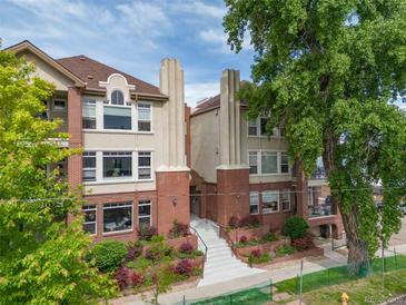 Brick building with multiple units and landscaping at 1735 N Ogden St # 303, Denver, CO 80218