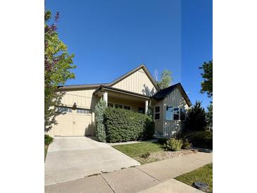 Charming single-Gathering home featuring a two-car garage, well-maintained lawn, and mature landscaping at 19 S 45Th Ave, Brighton, CO 80601