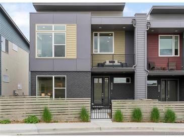 Contemporary home featuring a modern facade, private balconies, and low-maintenance landscaping at 928 Cimarron Dr # C, Lafayette, CO 80026