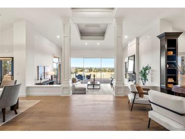 Bright living room featuring hardwood floors, ample natural light, and stylish furniture at 93 Glenmoor Dr, Cherry Hills Village, CO 80113
