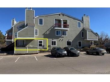 Inviting condo exterior features a charming patio and convenient parking at 992 S Dearborn Way # 7, Aurora, CO 80012
