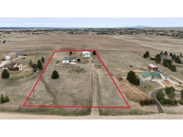 Expansive lot with mature trees, an outbuilding, and a home in a rural setting, perfect for country living at 2845 Cherry Way, Parker, CO 80138