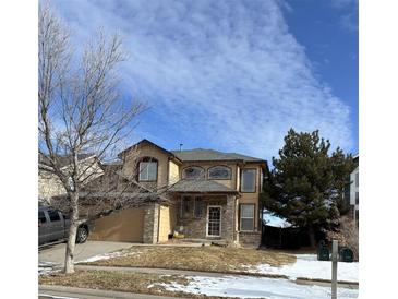 Two-story house with attached garage, landscaping, and a spacious front yard at 5416 S Gray St, Littleton, CO 80123